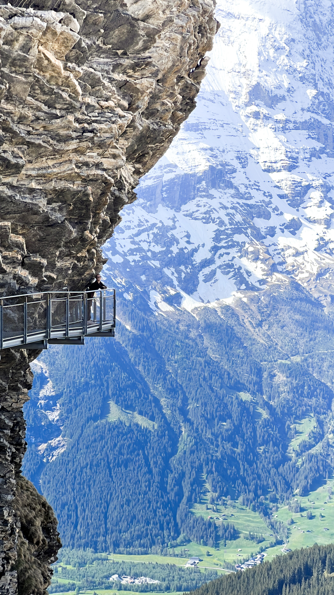 Cliff walk overlooking an alpine valley