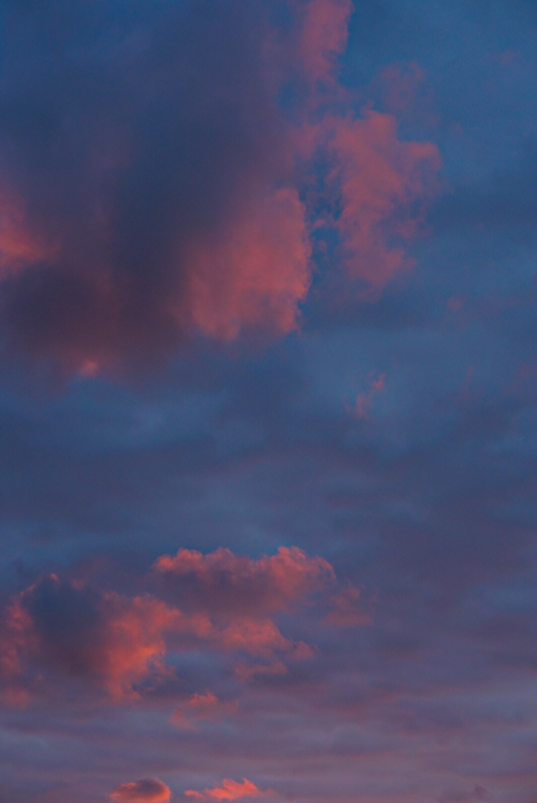 Pink and blue clouds at dusk over Biarritz