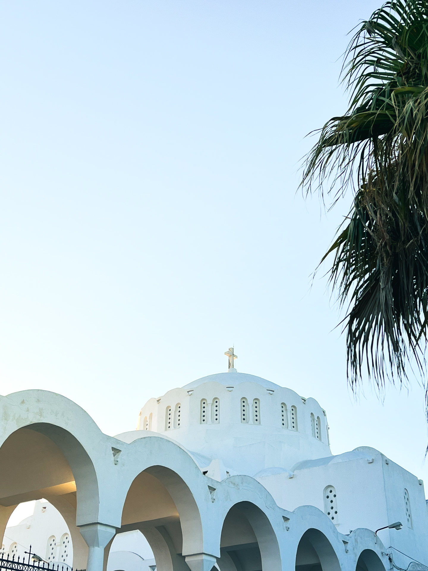White church with arches in Santorini