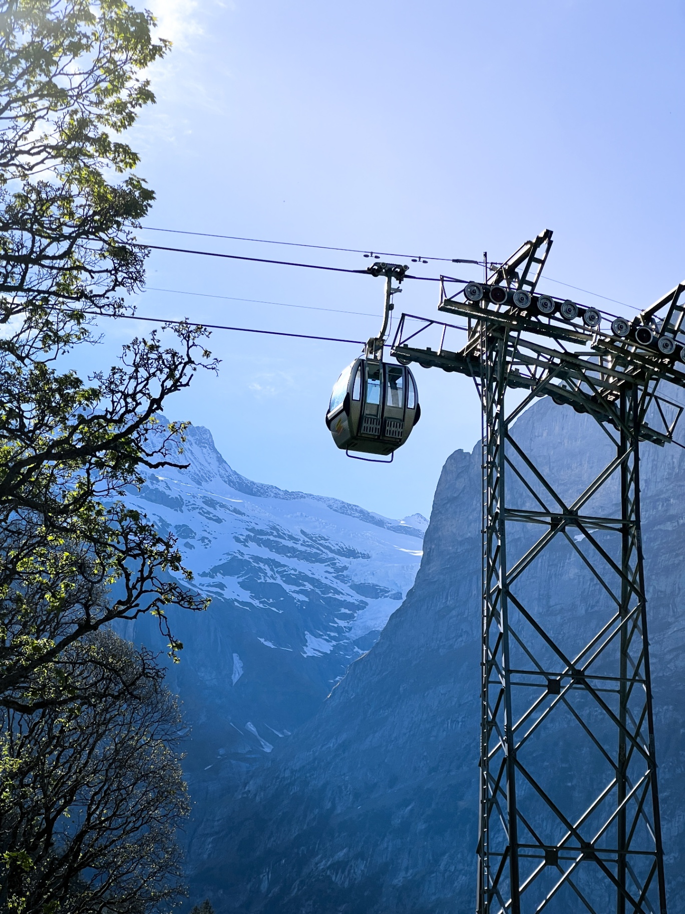 Cable car against a mountain backdrop